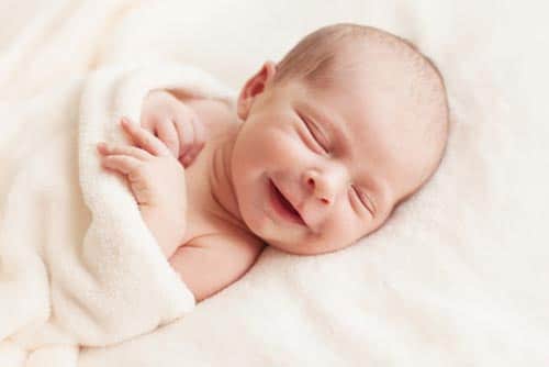 Newborn baby smiling