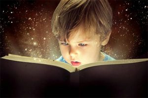 Child in awe of reading a book