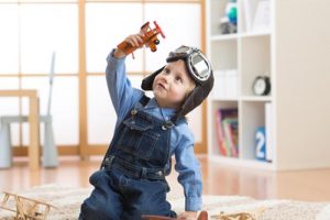 Toddler playing with his toys