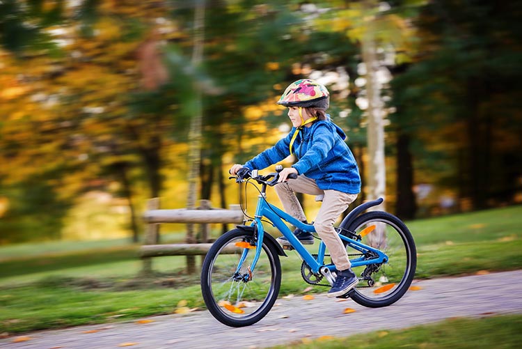 A young girl cycling.