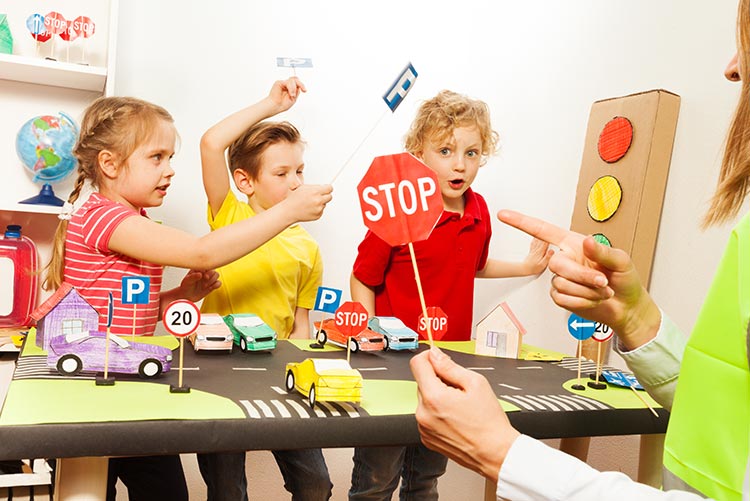 A group of kids learning road safety rules.