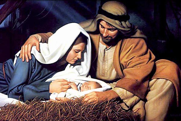 Mary and Joseph holding baby Jesus in a cattle shelter.