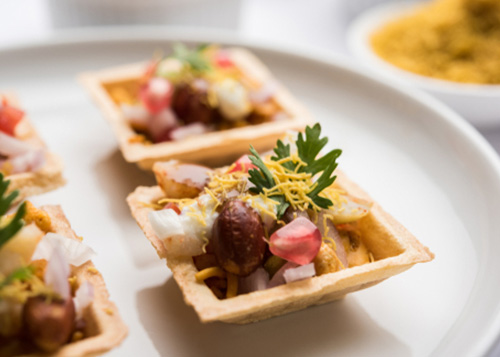 Desi canapes served on a plate.