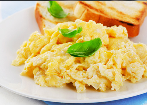 Scrambled eggs served with toast.
