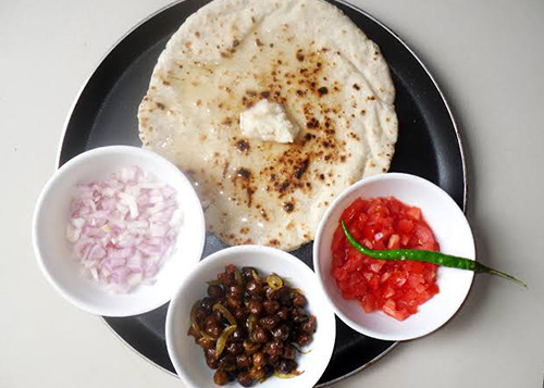 Rice Roti served with butter and vegetable salad.