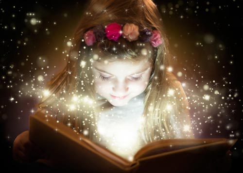 Girl wearing a flower crown and reading a book out of which magical sparks are flying