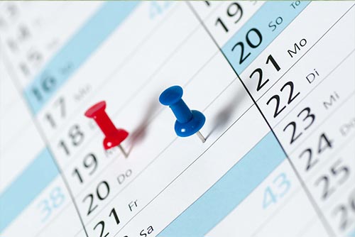  Pins marking dates on a calendar
