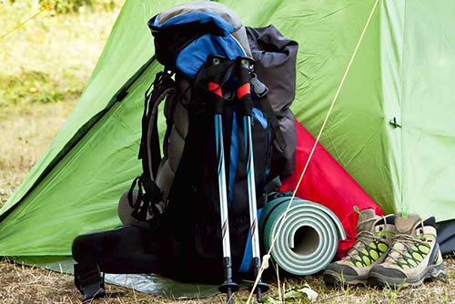 Camping equipment placed outside a tent