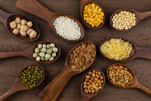 Different types of grains in spoons