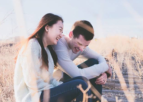 Husband and wife laughing