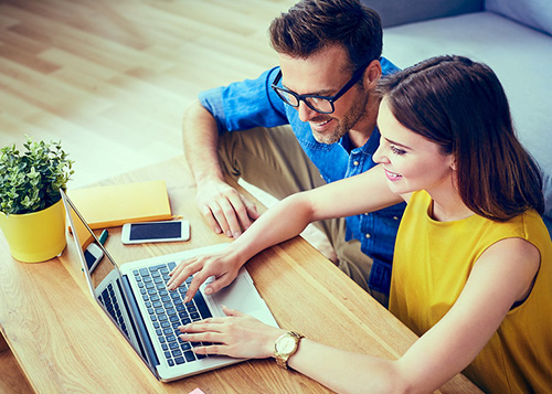 Couple looking at a laptop