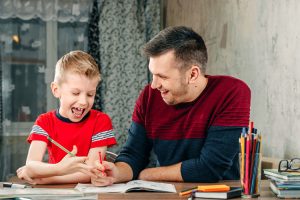 Father helping son with homework!