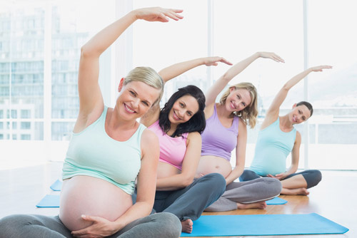 Group of pregnant women stretching