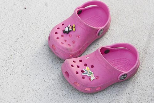 A pair of pink crocs.