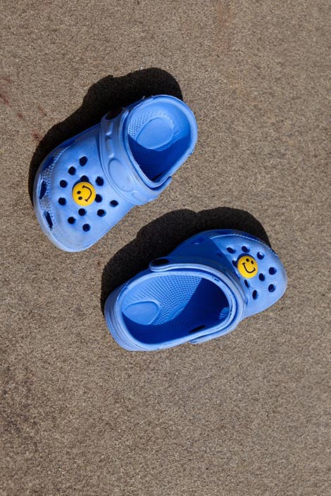 A pair of blue crocs.