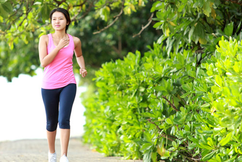 Woman brisk walking in the park