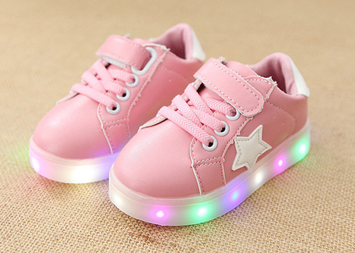 A pair of pink LED shoes.