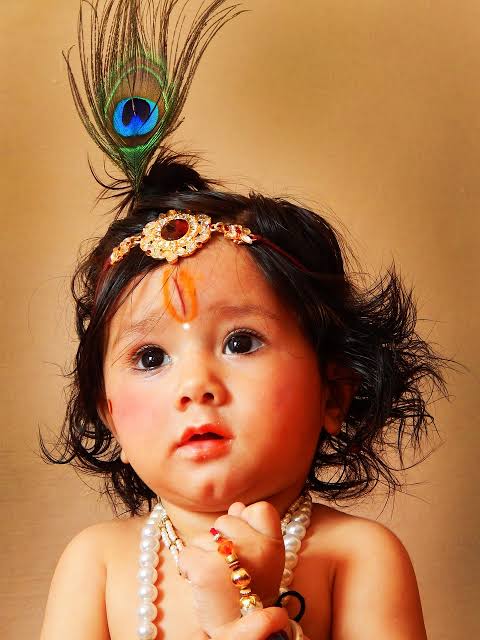 Girl dressed as Lord Krishna