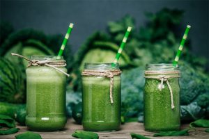 Spinach smoothie served with straws!