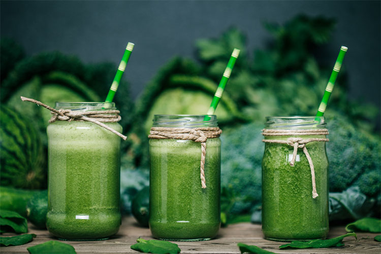 Spinach smoothie served with straws!