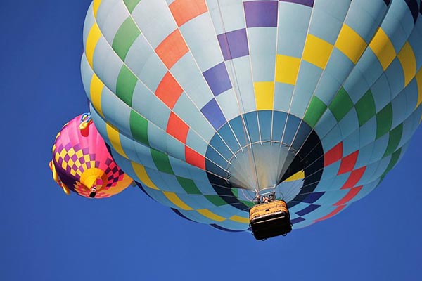 Picture of two hot air balloons in the sky