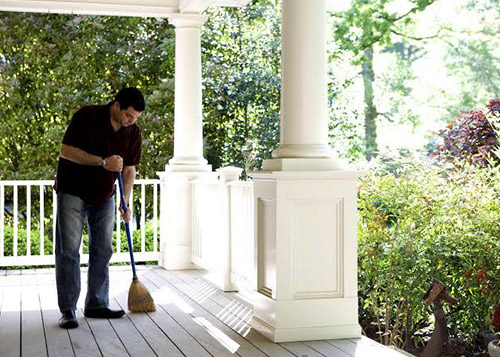  A man sweeping with the broom