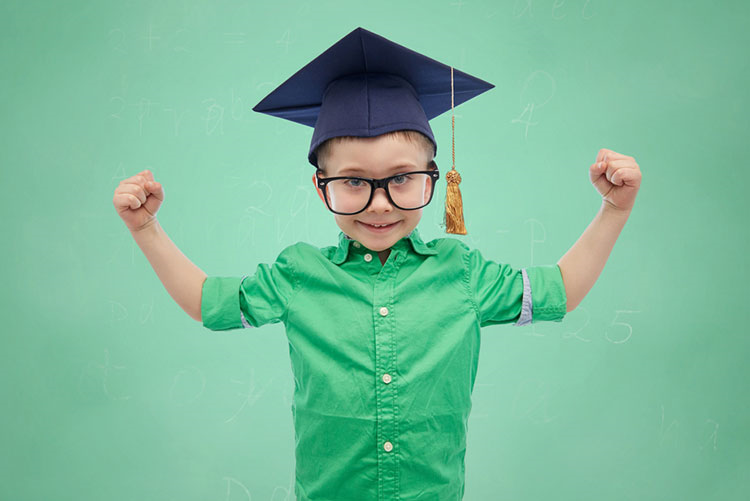 Adorable young boy wearing a graduation hat!