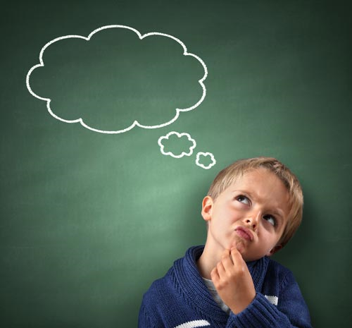 A child deep in thought with imaginary clouds above his head