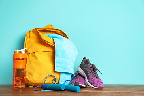 Gym equipment including a bag, water bottle, skipping rope, and shoes