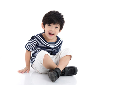 Boy sitting and sliding on the floor