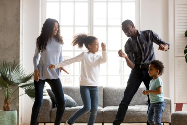 Family dancing in the living room 