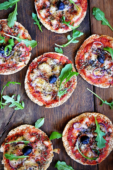 Pizzas made from pita bread. Contain celery, sauces, vegetables, seasoning, and are baked.