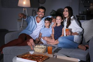 Family watching movie at home