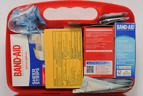 A medical kit filled with bandages, gauze, and other medicines to take care of your children on a road trip.