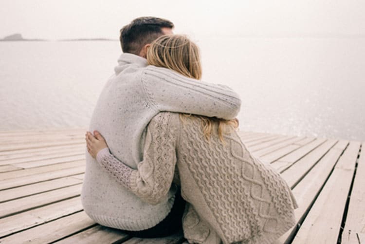 Husband hugging wife with Post Partum depression