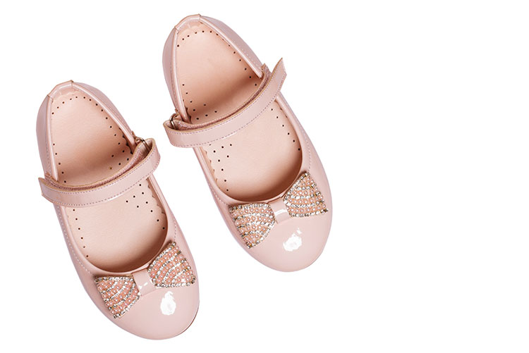 A girl's ballerina shoes with bows.