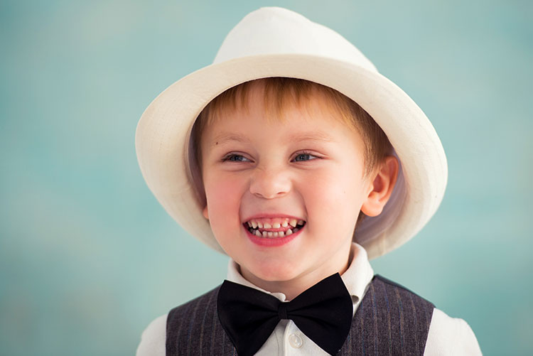 A boy wearing a hat.