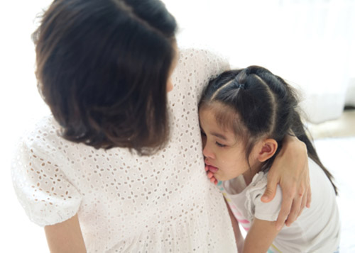 Mother consoling the daughter