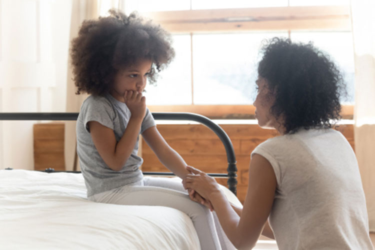 Mother talking to daughter