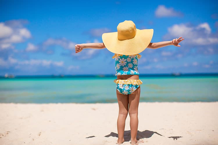 A girl enjoying the beach breeze.