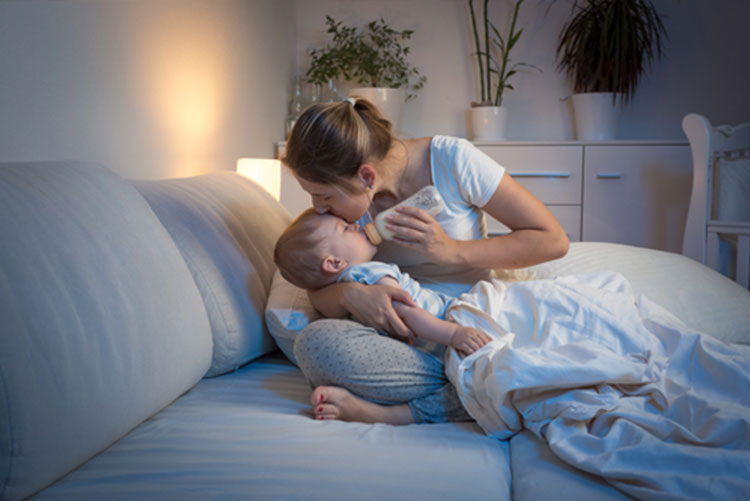 Mom feeding the baby at night