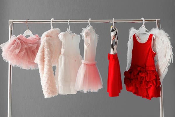 Clothing rack with skirts, dresses, and faux fur coats
