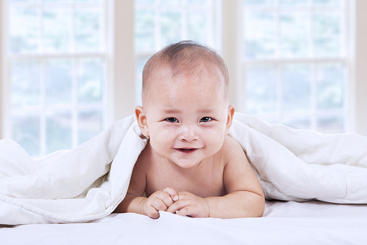 A smiling young boy.