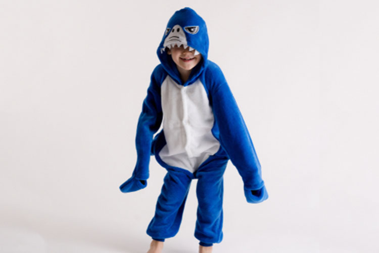 Boy in a shark onesie