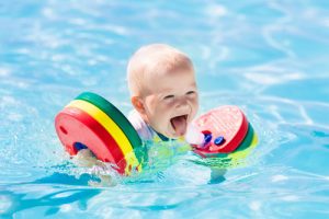 Adorable toddler in a swimming pool