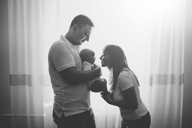 Mom and dad holding their newborn baby!