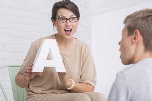 A speech therapist conducting a session.