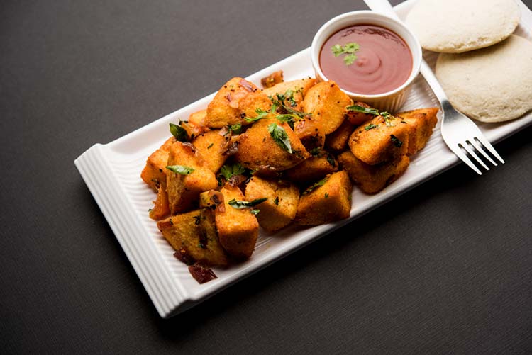 Masala fried idlis served with tomato ketchup and a fork!