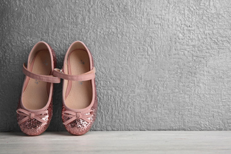 Pair of glittery pink mary jane shoes