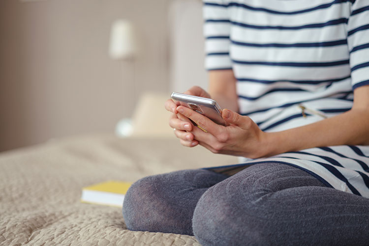 A woman using her mobile phone.